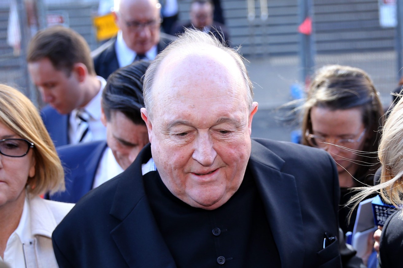 Archbishop Philip Wilson leaves the Newcastle Local Court yesterday. Photo: AAP/Peter Lorimer