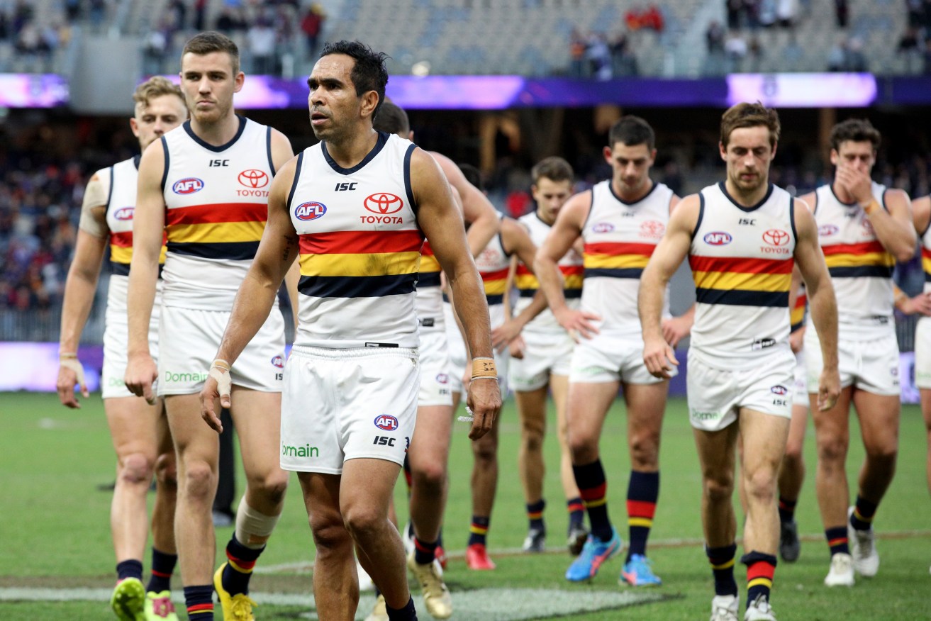 Eddie Betts leads Crows teammates off the field after losing to Fremantle on Sunday. Photo: Richard Wainwright / AAP