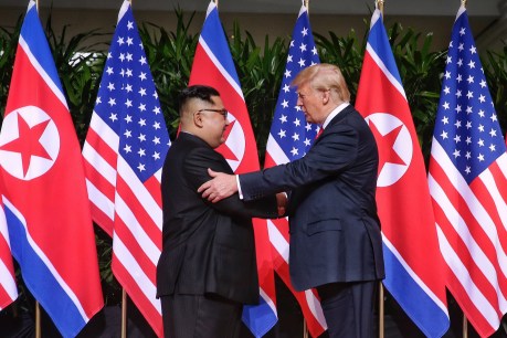 With a handshake, Trump and Kim vow to ‘leave the past behind’