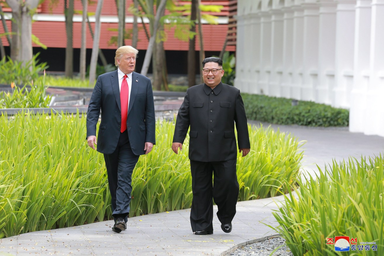 A photo released by the official North Korean Central News Agency (KCNA) shows Korean leader Kim Jong-un and US President Donald  Trump during a summit at Sentosa Island, Singapore.