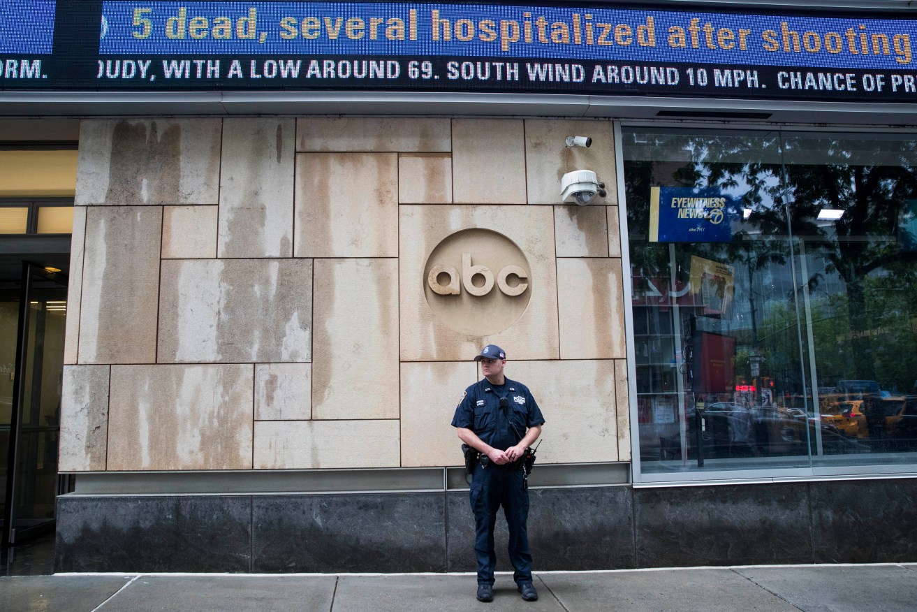 A police officer stands guard outside the ABC studio in New York. The New York Police Department has sent patrols to major news media organizations in response to the shooting in Annapolis. Photo: AP/Mary Altaffer