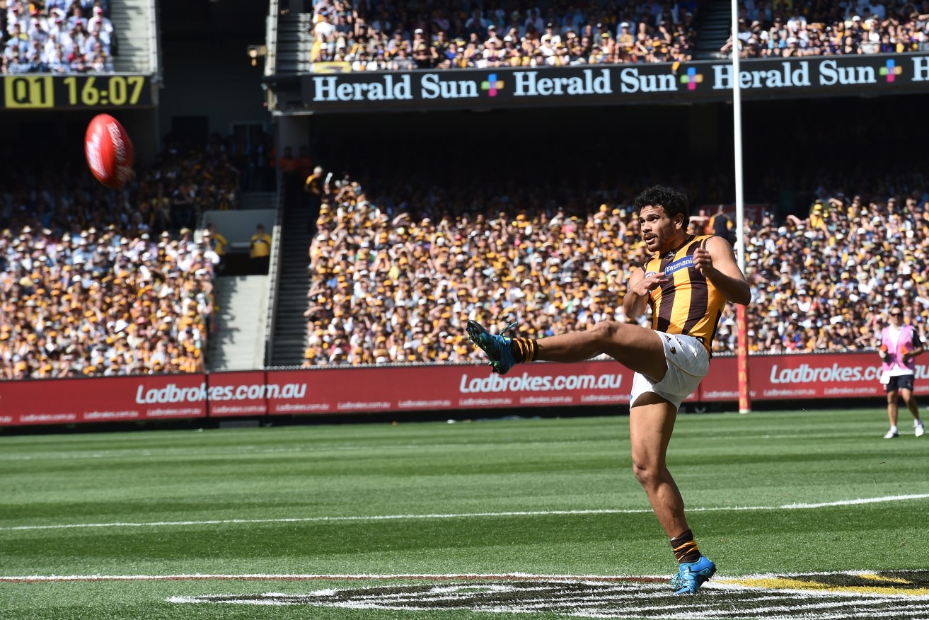 Cyril Rioli on his way to winning the Norm Smith Medial during the 2015 grand final. Photo: AAP/Julian Smith