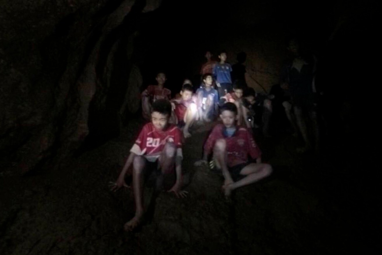 The missing boys and their soccer coach in the partially flooded cave in Mae Sai, Chiang Rai, Thailand. Photo: Tham Luang Rescue Operation Center via AP