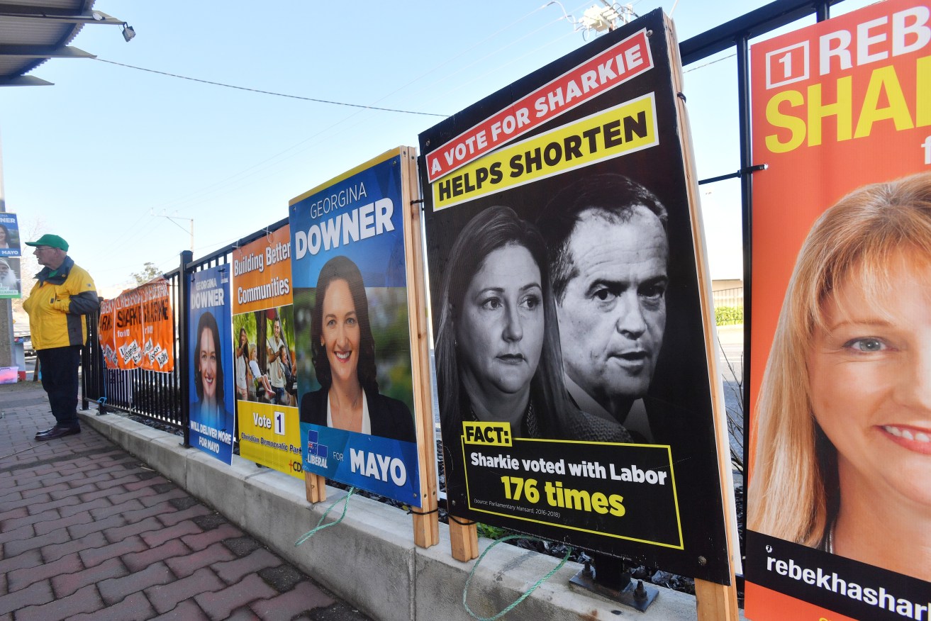 Campaign posters outside the pre-poll booth in Mt Barker. Photo: AAP/David Mariuz