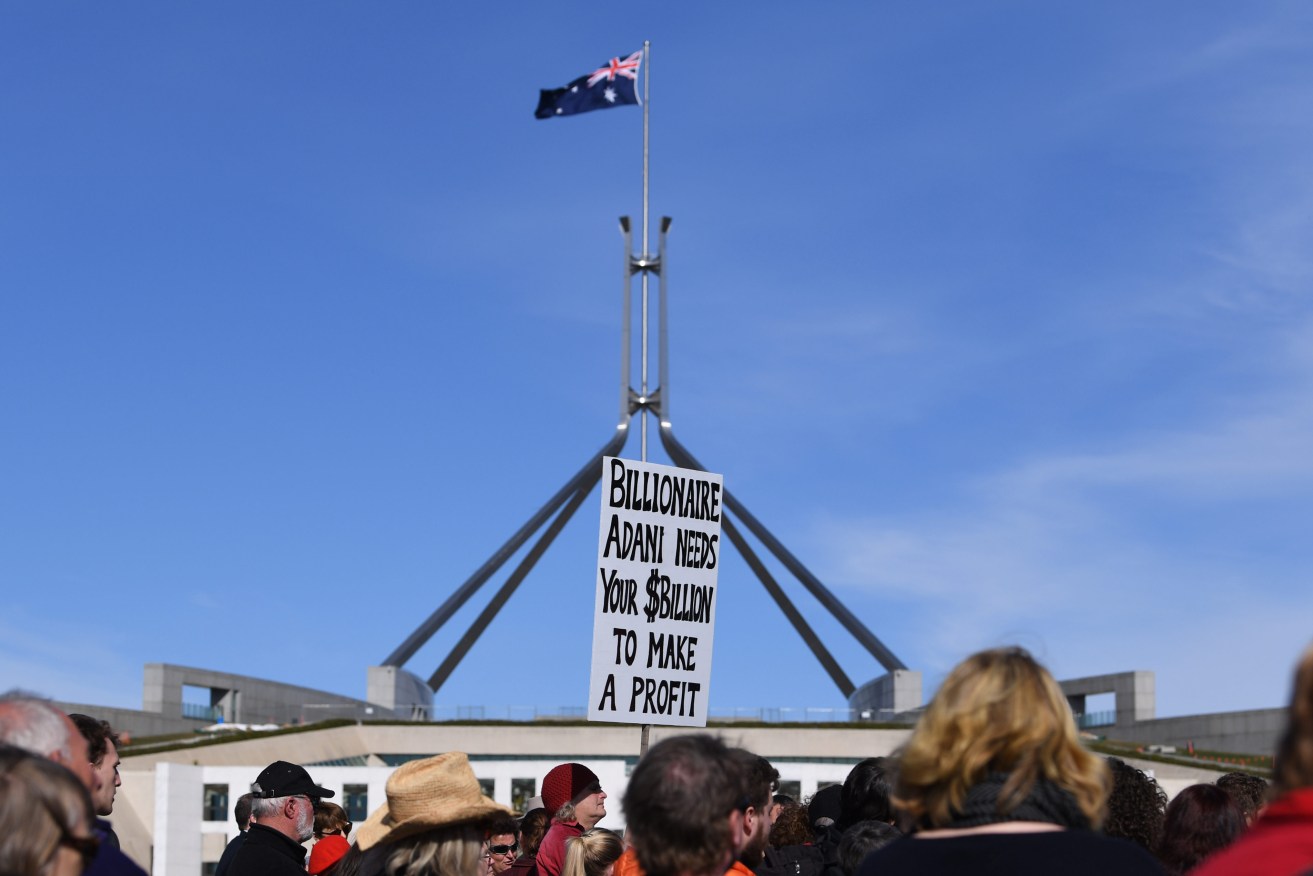 Protesters against the Adani coal mine outside Parliament House in Canberra last year. Photo: Lukas Coch / AAP