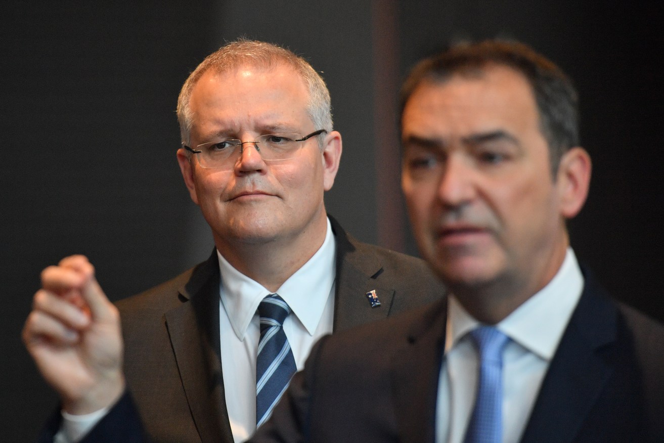 Liberal challenger Scott Morrison watches as Premier Steven Marshall speaks to the SA Liberal Party's AGM earlier this month. Photo: David Mariuz / AAP