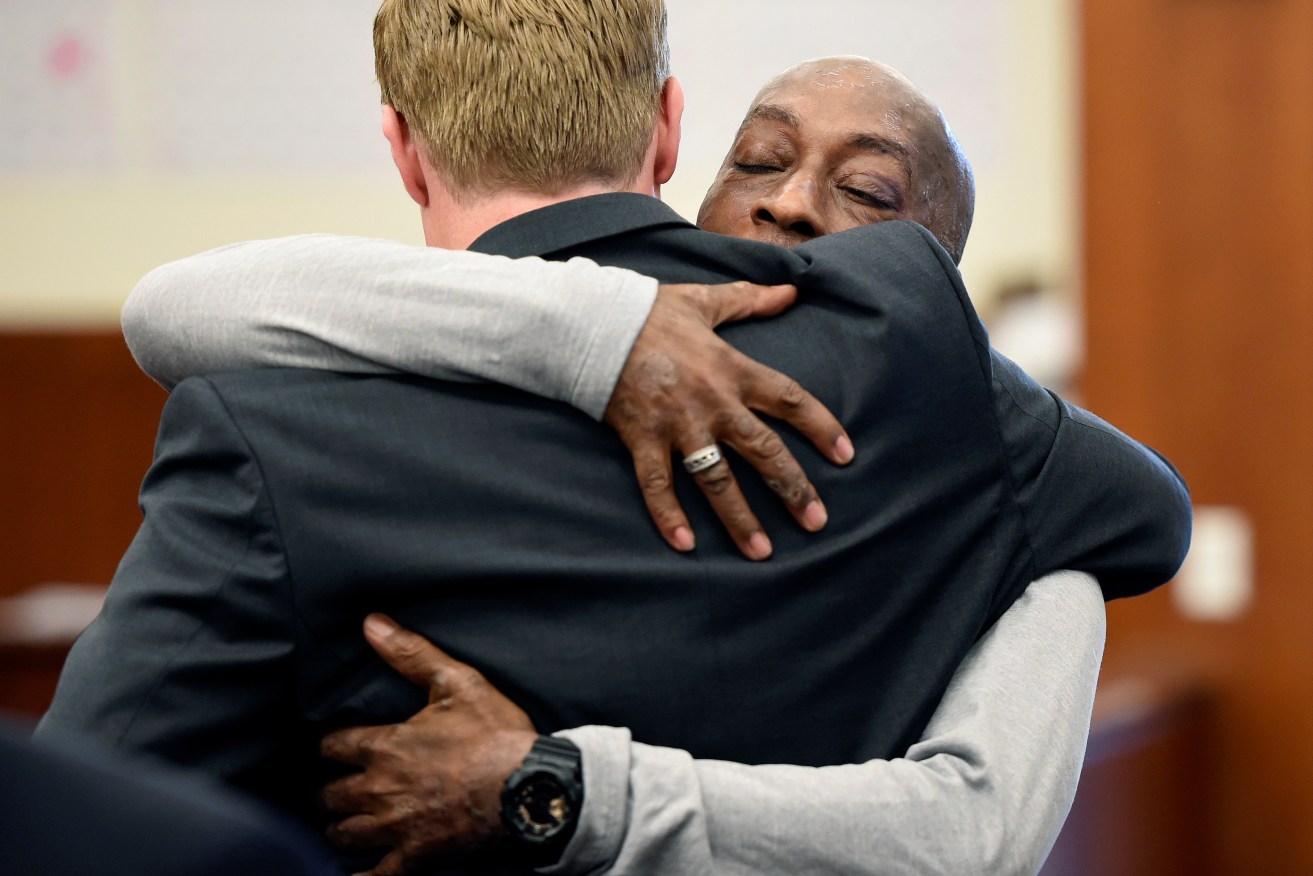 Dewayne Johnson hugs one of his lawyers after winning his case against Monsanto at the Superior Court of California. Photo: Josh Edelson/Pool Photo via AP
