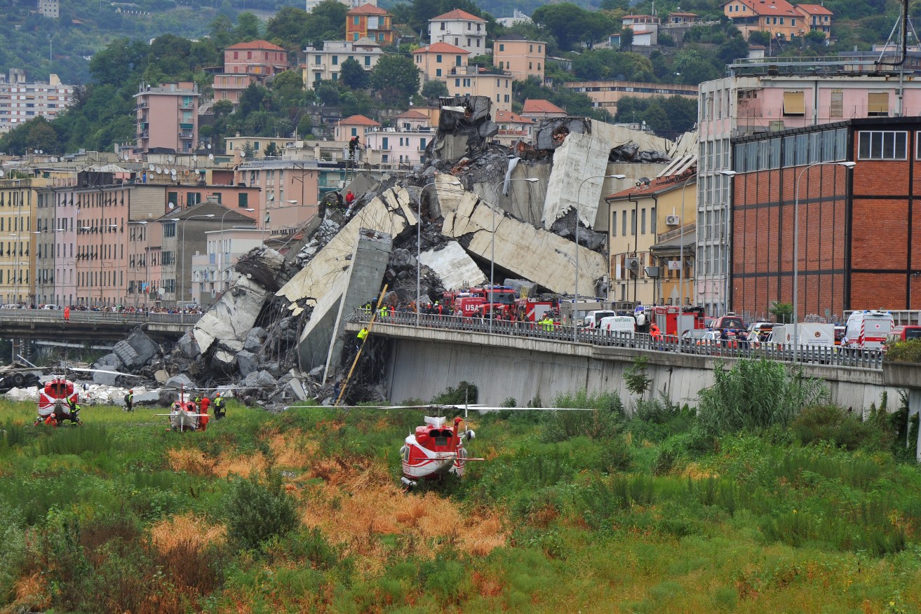 The collapsed section of the Morandi viaduct upon which the A10 motorway runs in Genoa. Photo: IPA