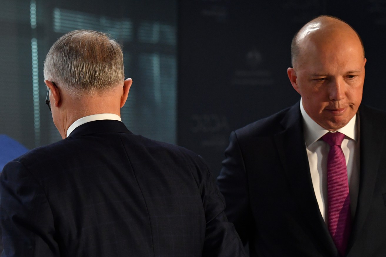 Malcolm Turnbull and Peter Dutton cross paths earlier this month. Photo: Mick Tsikas / AAP