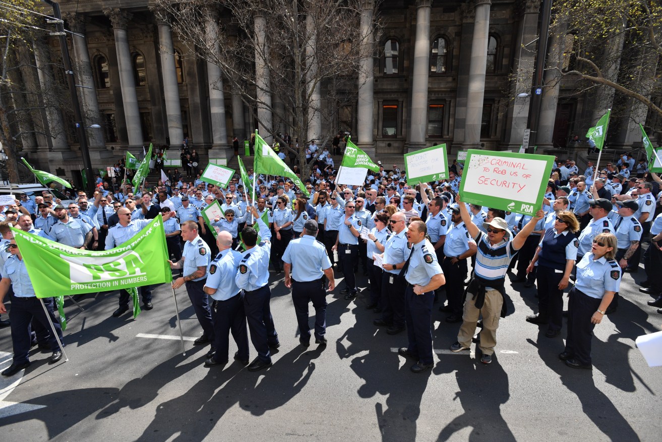 PSA members protest outside Parliament House today. Photo: AAP/David Mariuz