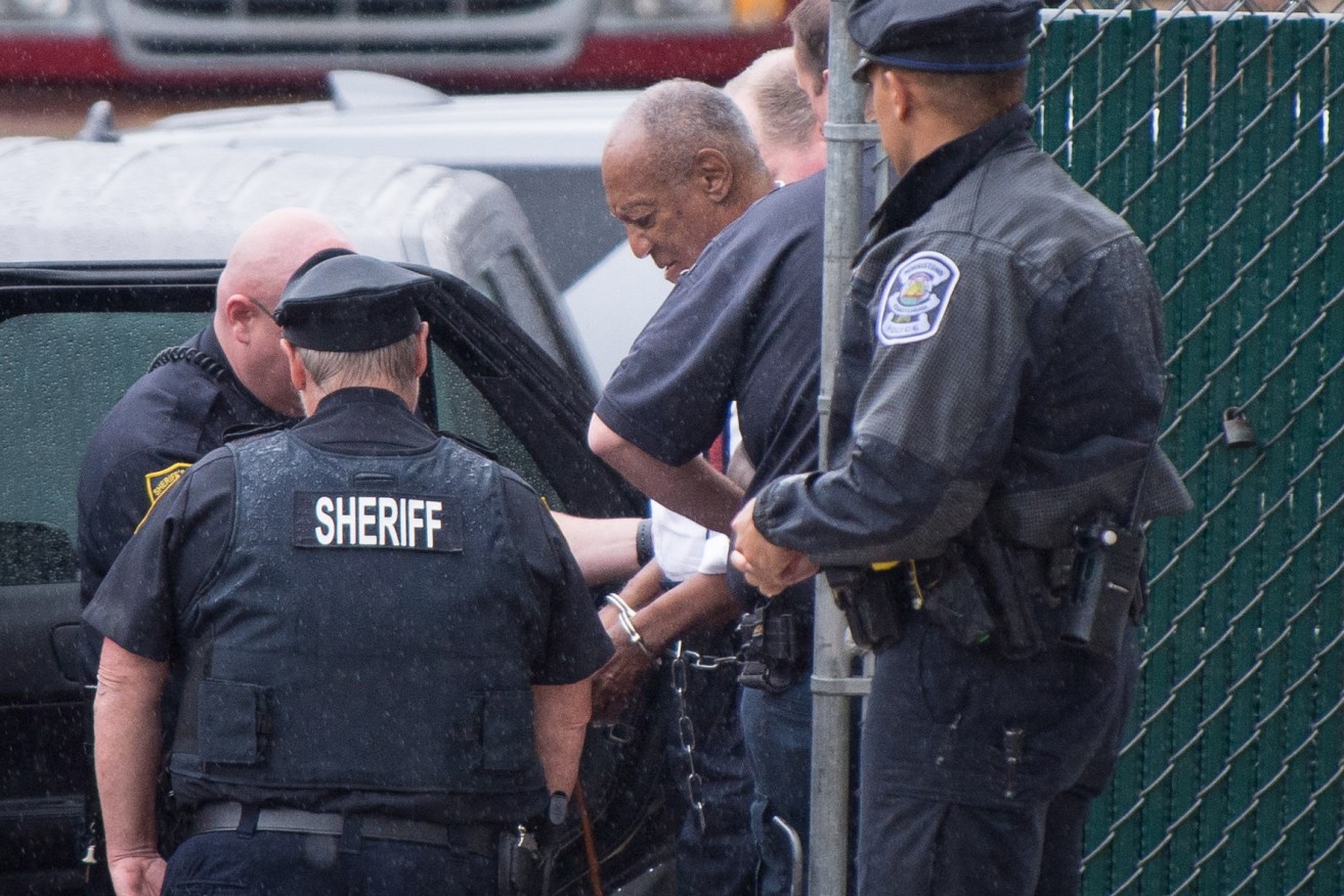 Bill Cosby is escorted in handcuffs from the Montgomery County Courthouse in Norristown, Pennsylvania. Photo: EPA/Tracie Van Auken