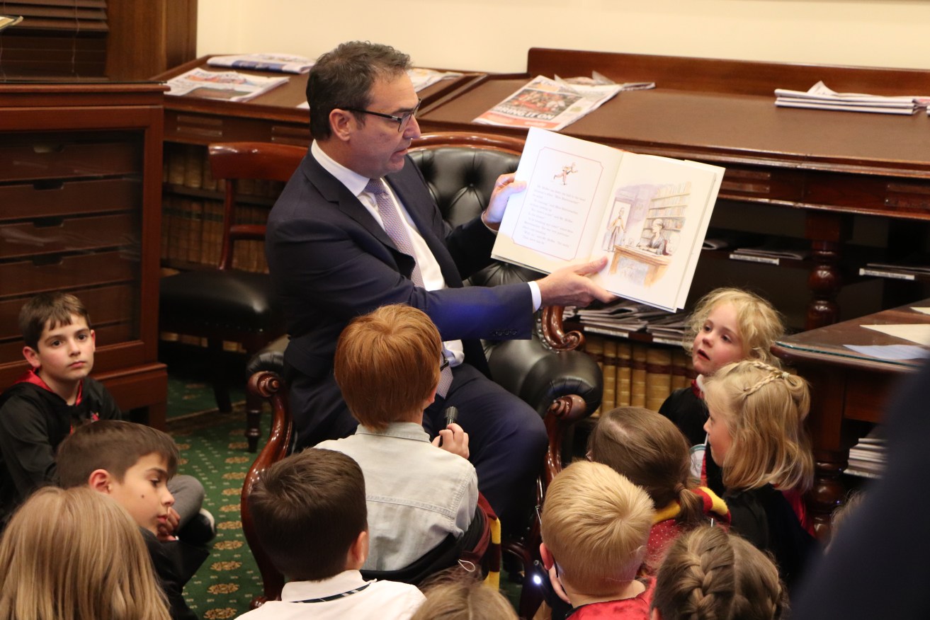 Steven Marshall reads to Harry Potter-garbed parliamentary visitors. Photo: Supplied