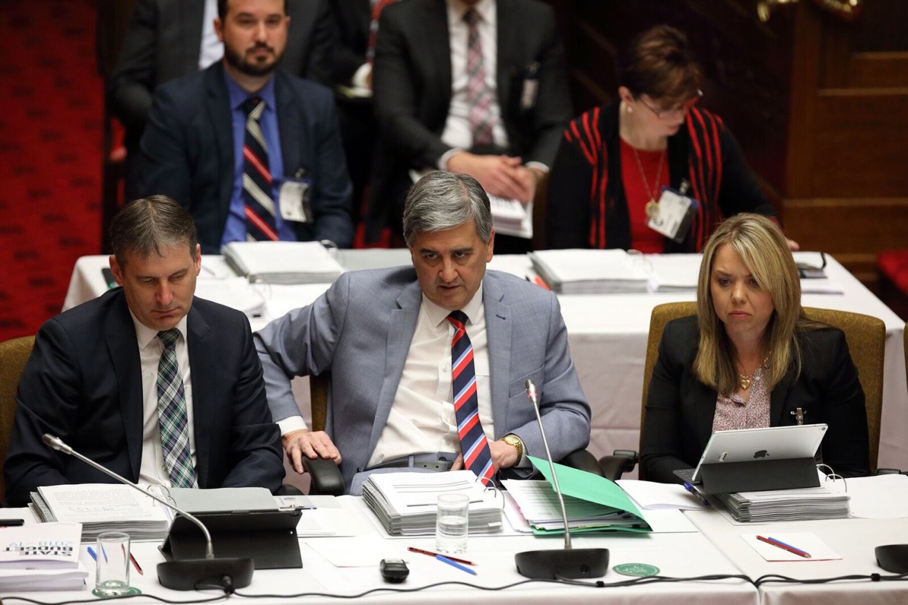 Rob Lucas flanked by his Treasury bureaucrats in Estimates today. Photo: Tony Lewis / InDaily