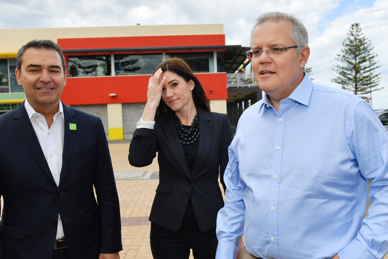 Prime Minster Scott Morrison (right) in Adelaide yesterday with Premier Steven Marshall and local MP Nicolle Flint. Photo: AAP/David Mariuz