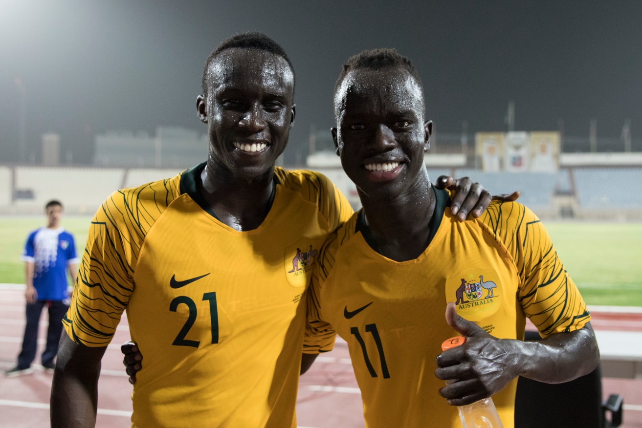 Socceroos Thomas Deng and Awer Mabil after Monday's match in Kuwait. Photo: Football Federation Australia/Tristan Furney