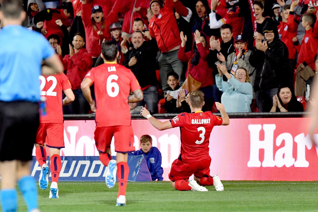 Scott Galloway, the unsung signing of the off-season, celebrates his goal for Adelaide United on Friday. Photo: AAP Image/Sam Wundke