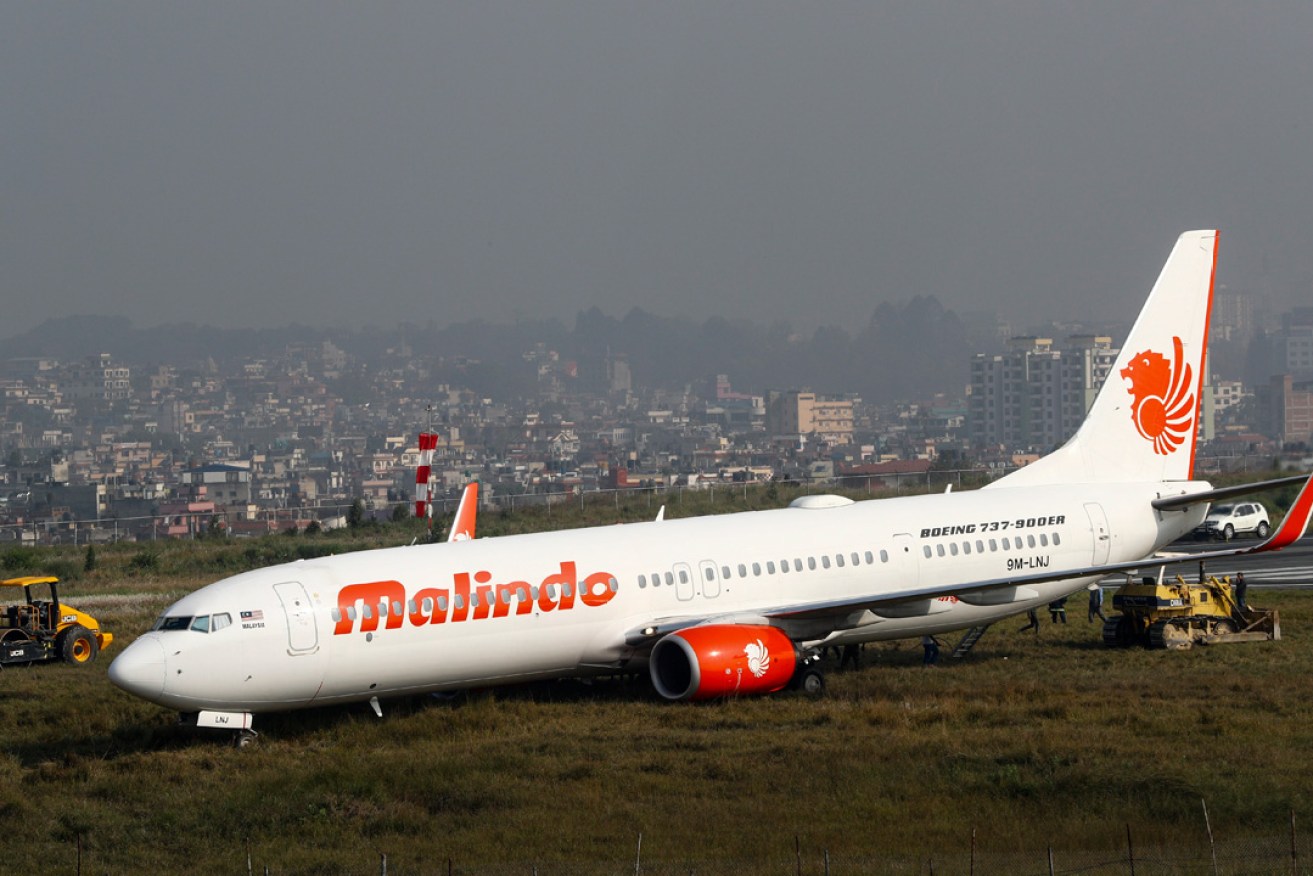 A Malindo Air Boeing 737-900 pictured in April this year, sitting idle after skidding off the runway at an airport in Kathmandu, Nepal. Photo:  EPA / Narendra Shrestha