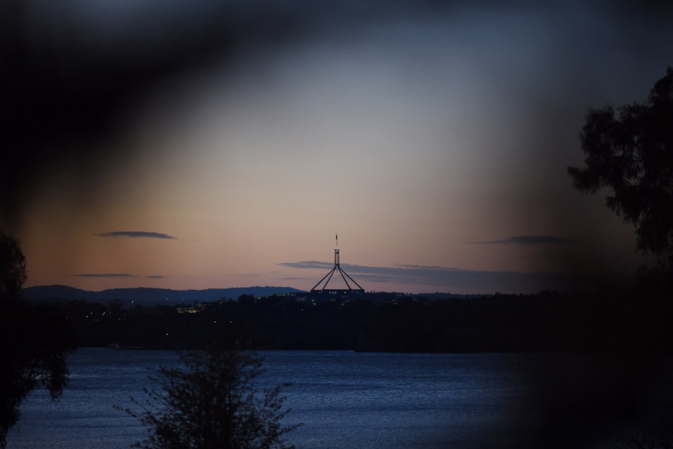 Parliament House at sunrise. Photo: AAP/Lukas Coch