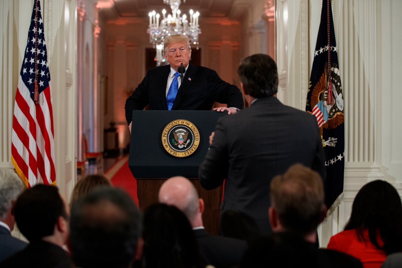 President Donald Trump listens to a question from CNN journalist Jim Acosta during a news conference at the White House. Photo: AP/Evan Vucci
