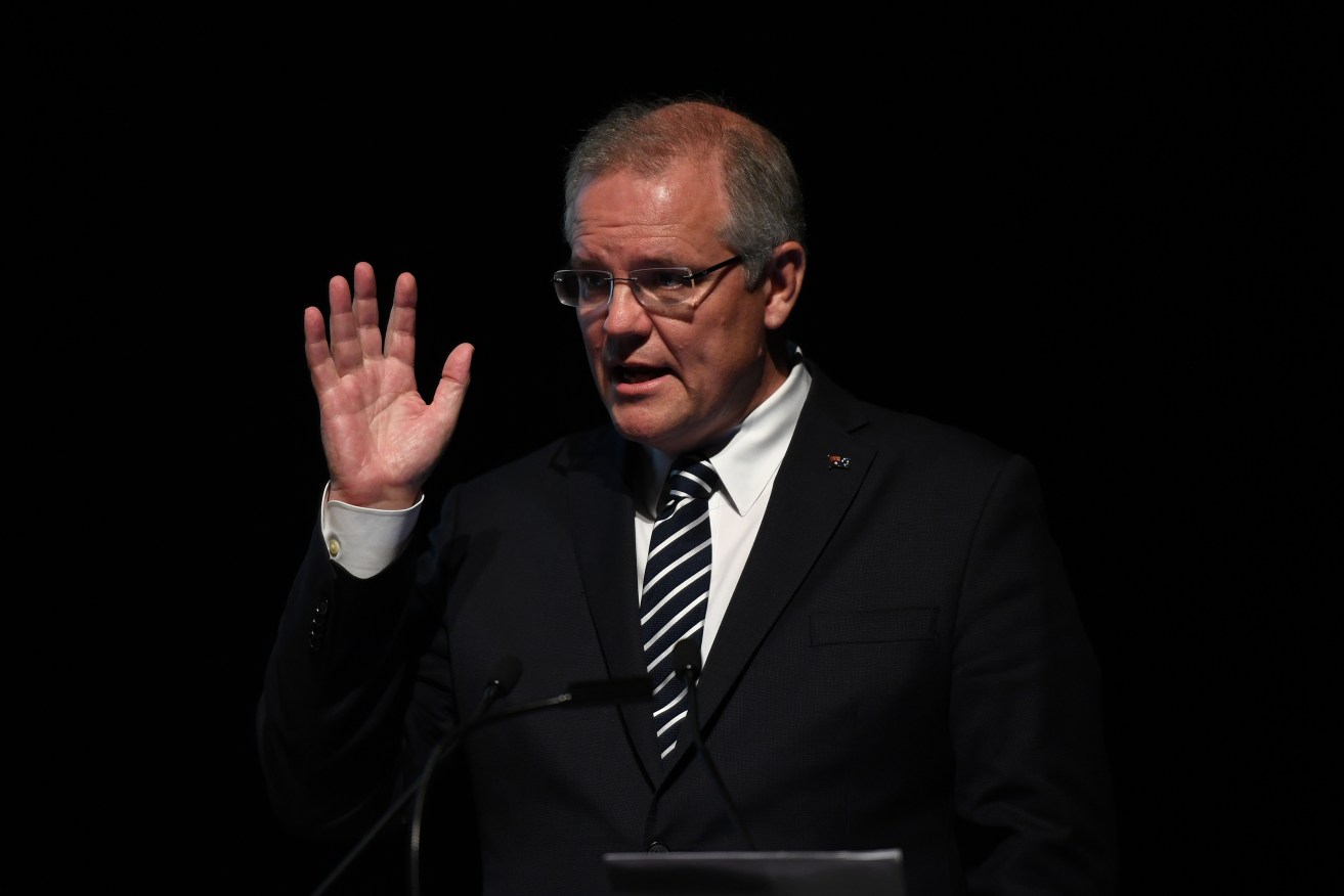Prime Minister Scott Morrison speaks in Sydney last night. Photo: Joel Carrett / AAP