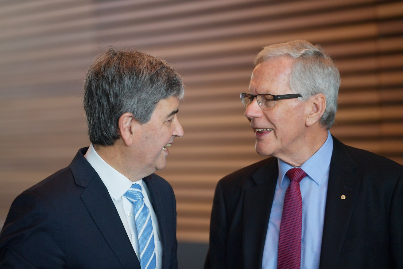 Liberal veteran Rob Lucas chats with former Premier Dean Brown at last year's party AGM. This week marks 25 years since Brown led the Liberals to victory. Photo: David Mariuz / AAP