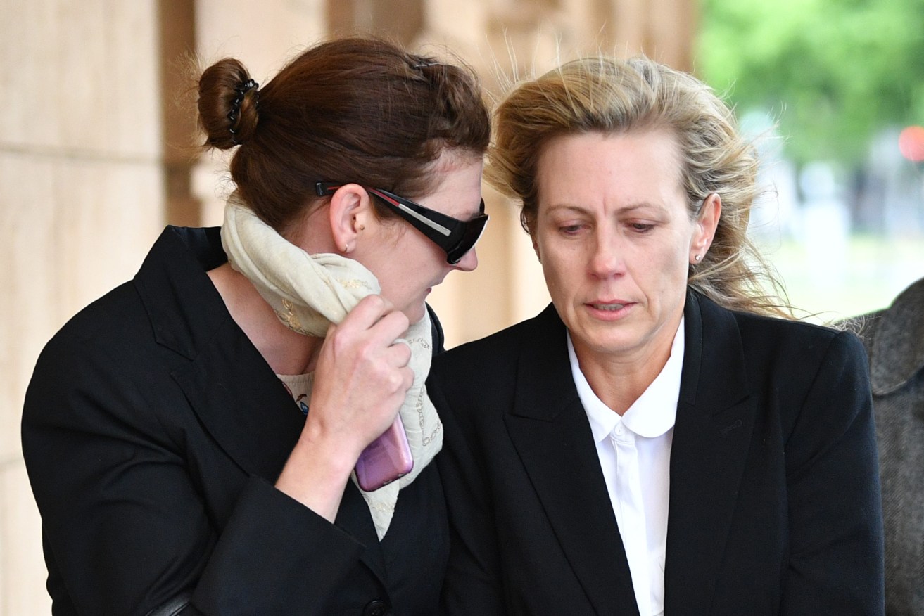 Former teacher Sonia Ruth Mackay (right)  outside the District Court in Adelaide. Photo: AAP/David Mariuz
