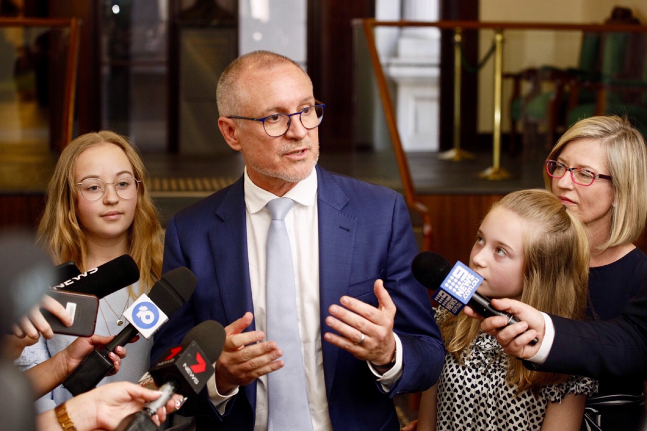 Jay Weatherill speaks to reporters after addressing parliament today, flanked by his wife Melissa and daughters Lucinda and Alice. Photo: Tony Lewis / InDaily