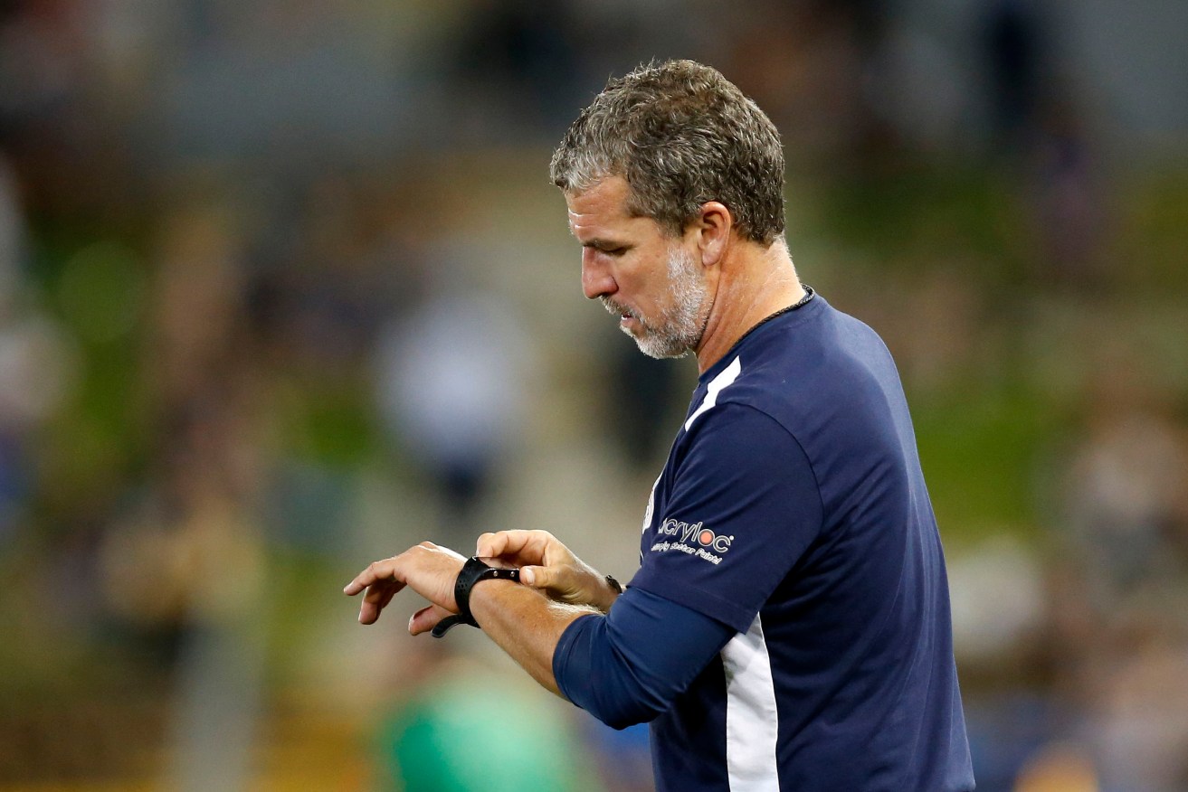 United coach Marco Kurz watches the clock during last month's win over the Newcastle Jets. Photo: Darren Pateman / AAP