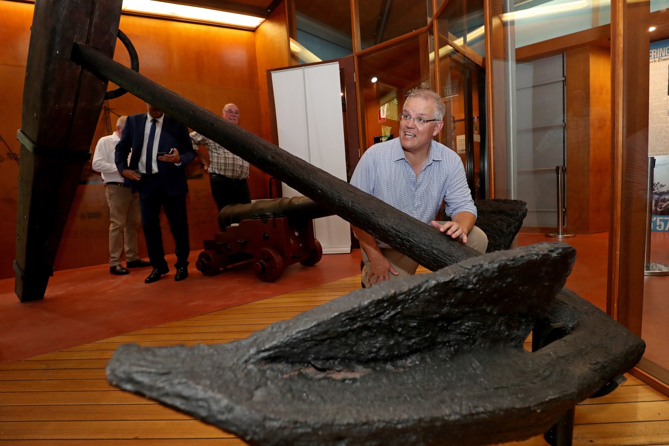 Prime Minister Scott Morrison in Cooktown with the anchor from James Cook's ship Endeavour. Photo: AAP/Marc McCormack