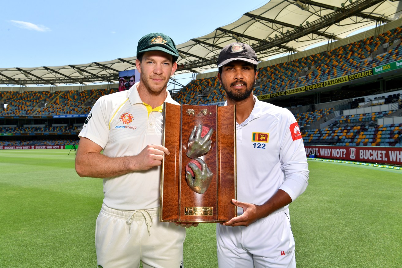 Sri Lankan Test Captain Dinesh Chandimal (right) with Australian skipper  Tim Paine at the Gabba. Photo: AAP/Darren England