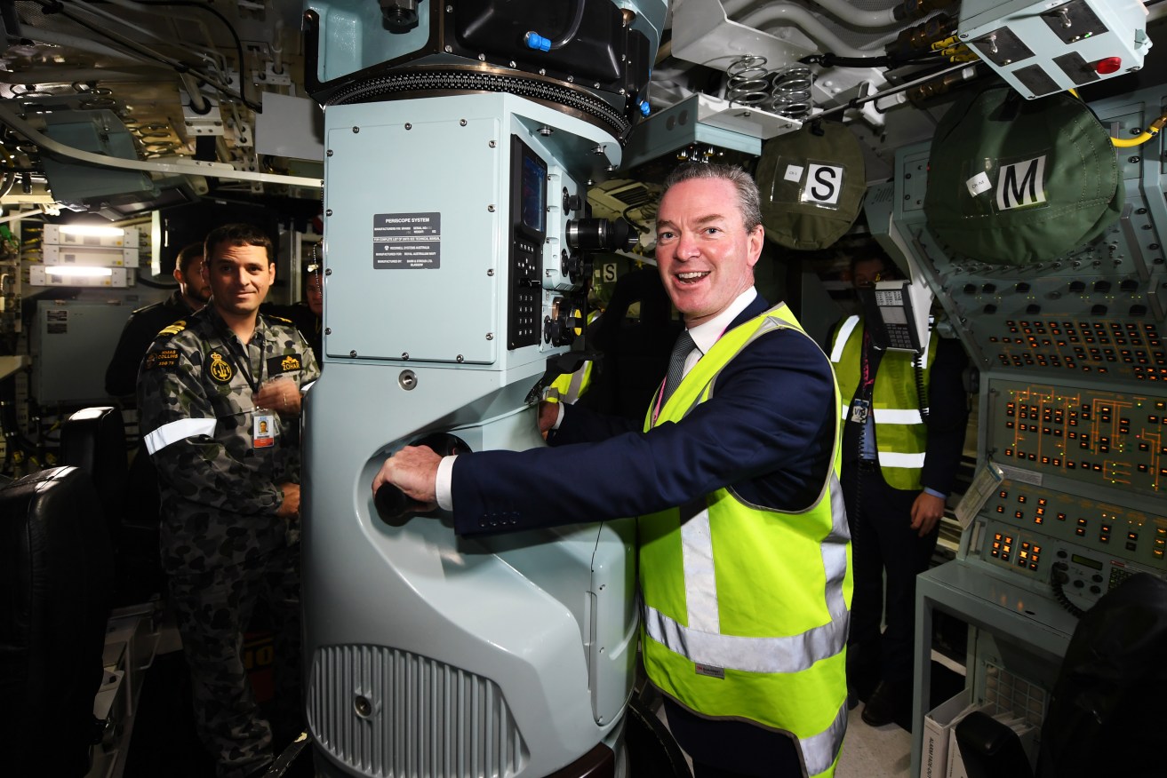 Defence Minister Christopher Pyne in a Collins Class submarine at ASC last year. Photo: AAP/Mark Brake
