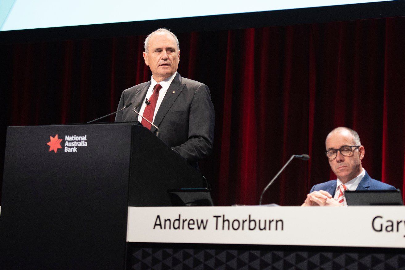 NAB chairman Ken Henry (standing) and chief executive officer Andrew Thorburn will both leave the business. Photo: AAP/Ellen Smith
