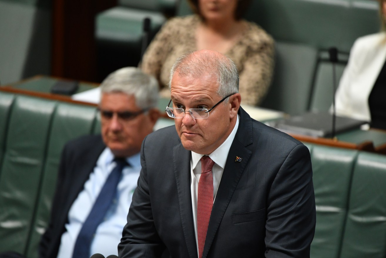 Prime Minister Scott Morrison detailing the cyber attacks in Parliament today. Photo: AAP/Mick Tsikas