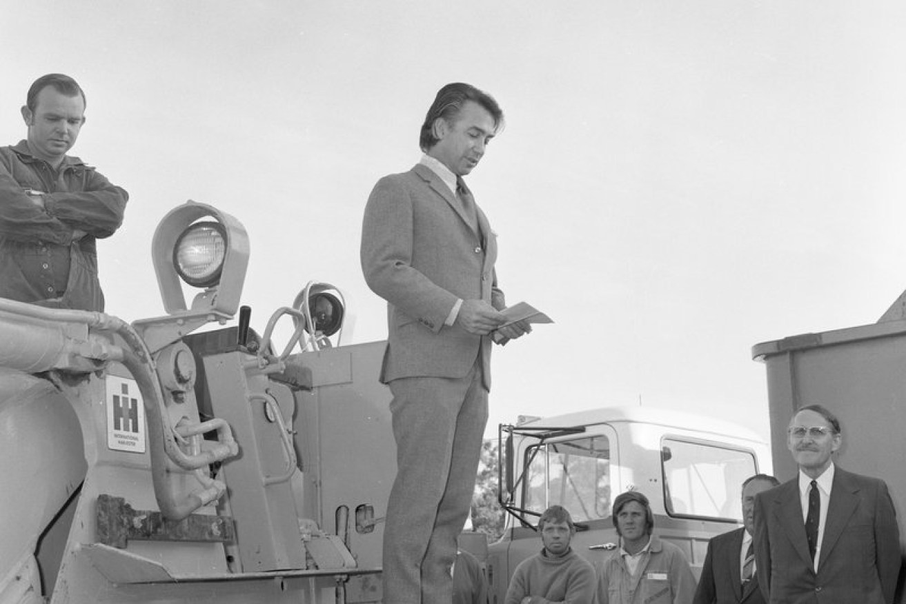 Don Dunstan standing on a bulldozer at the initiation of work ceremony for the construction of Flinders Medical Centre in 1972. Photo courtesy Dunstan Collection, Flinders University Library
 