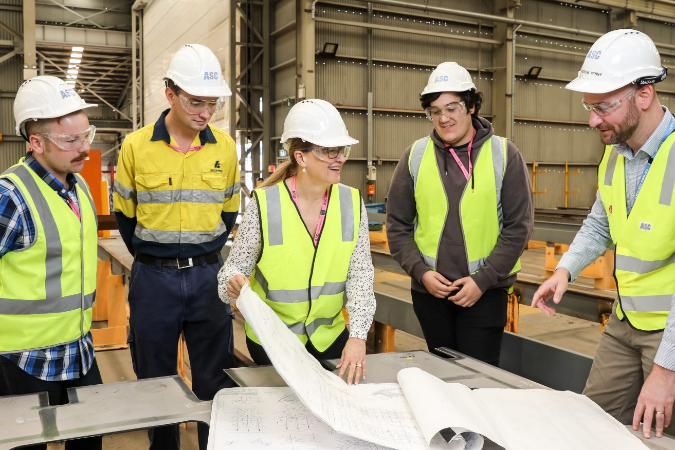 Margot Forster (centre) at ASC’s Osborne shipyard in December with winners of a scholarship program run by Offshore Patrol Vessel prime contractor Luerssen Australia and builders ASC and Civmec. Photo: Supplied