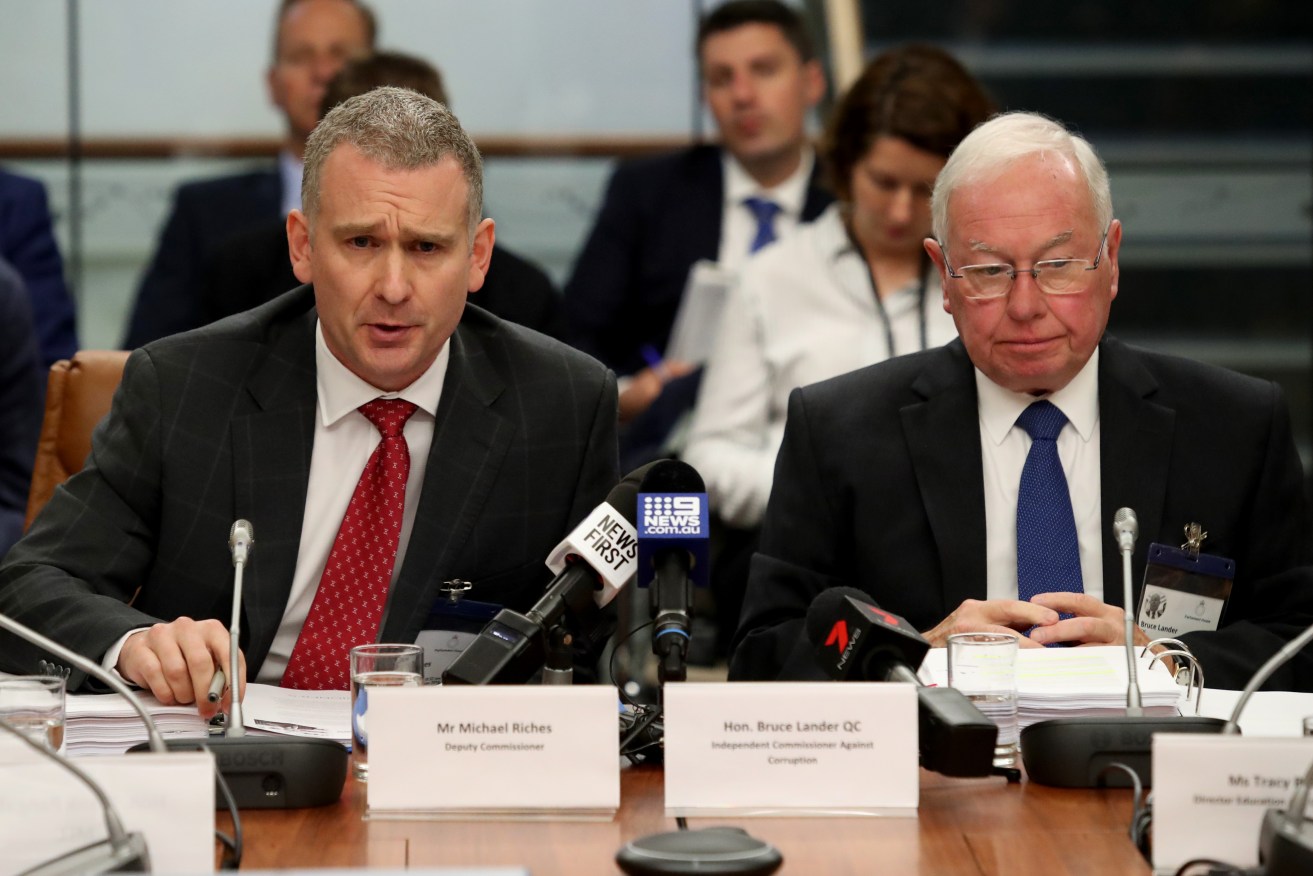 Independent Commissioner Against Corruption Bruce Lander and his deputy Michael Riches appearing before a parliamentary inquiry last year. Photo: Kelly Barnes / AAP