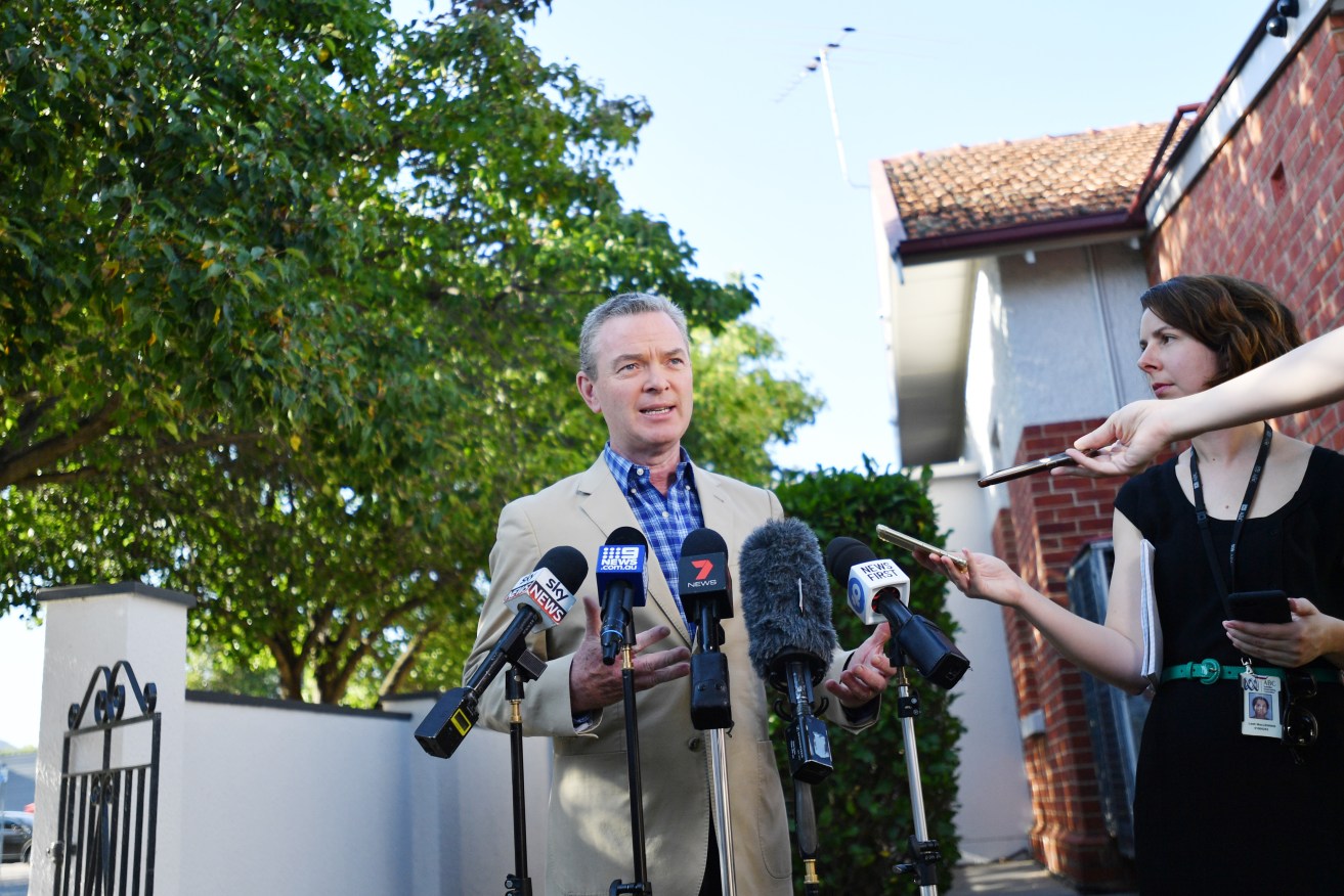 Christopher Pyne talks to the media outside his electorate office in Magill today. Photo: AAP/David Mariuz