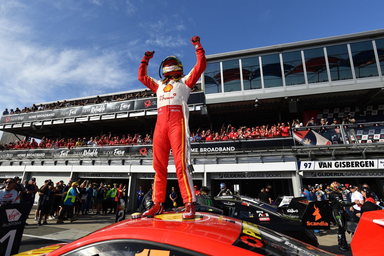 Scott McLaughlin celebrates his win at the Superloop Adelaide 500. Plenty of others also enjoying that winning feeling at the Government's suite. Photo: AAP/David Mariuz