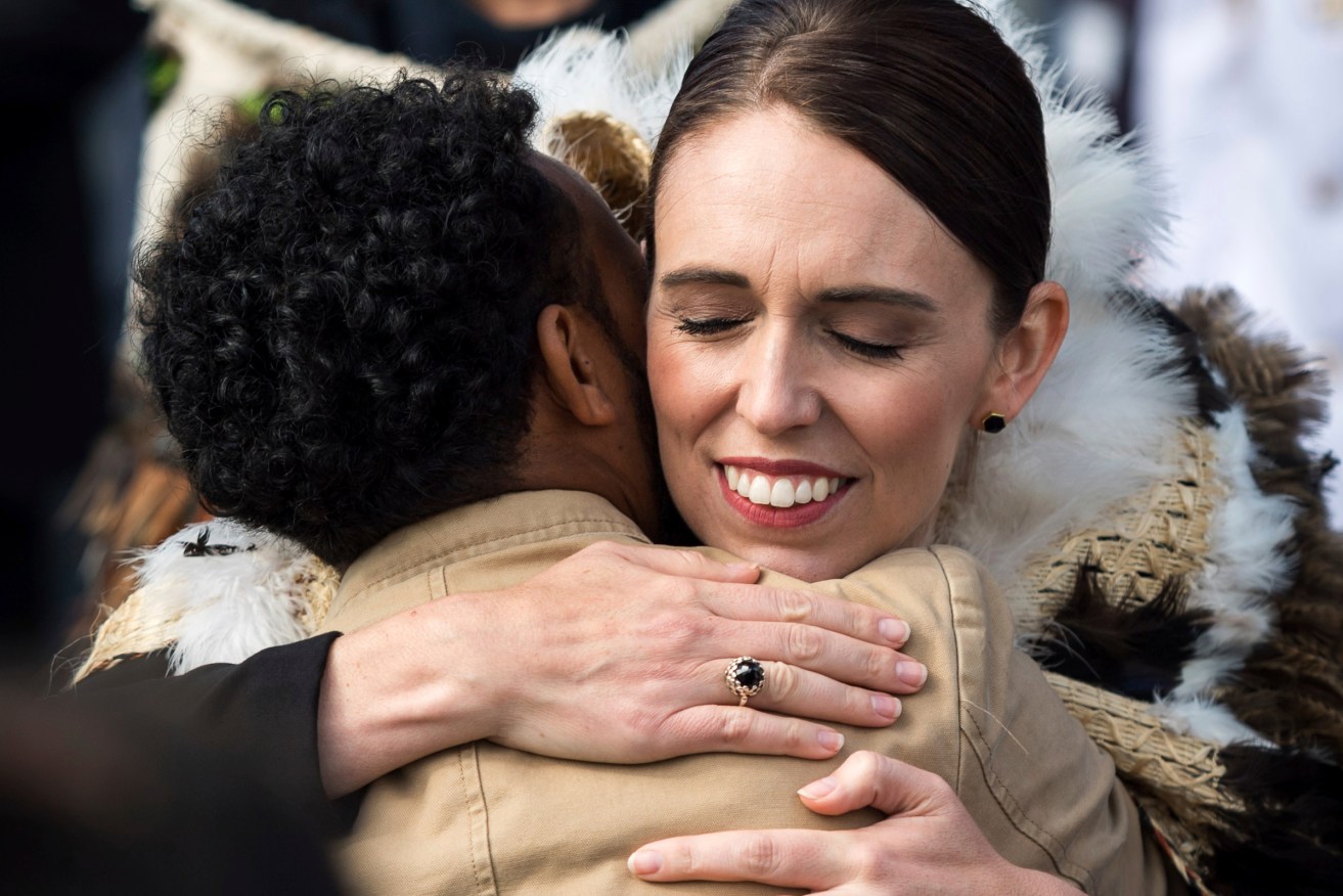 New Zealand Prime Minister Jacinda Ardern embraces a member of the Muslim community at a national remembrance service for  victims of the March15 mosque shootings. Photo: supplied.