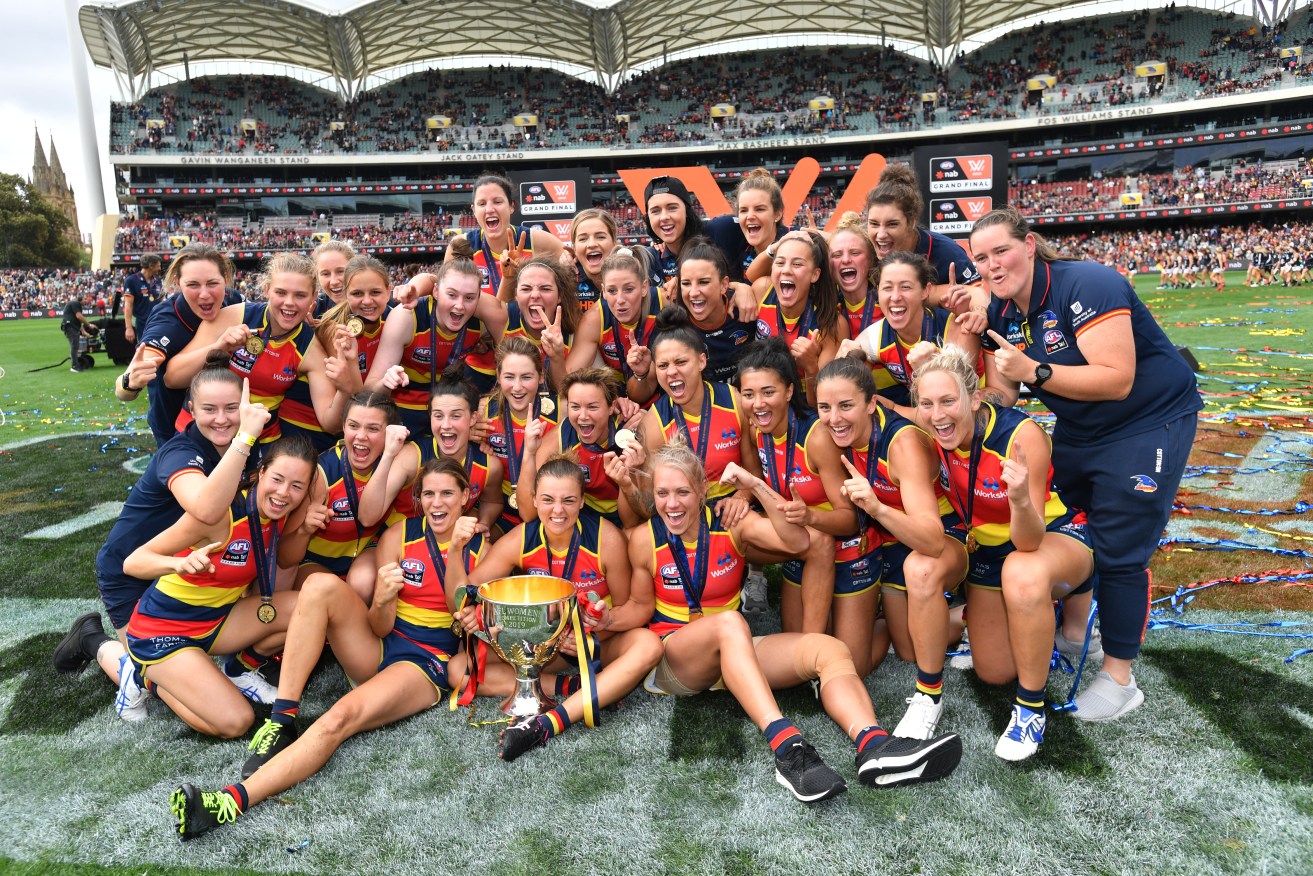 The Crows celebrate their 2019 AFLW Grand Final win over Carlton at Adelaide Oval. Photo: AAP/David Mariuz