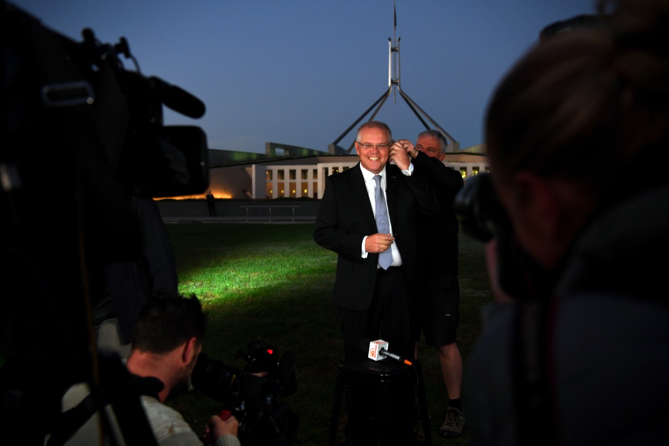 Prime Minister Scott Morrison selling his Budget in morning TV interviews outside Parliament House. Photo: AAP/Sam Mooy