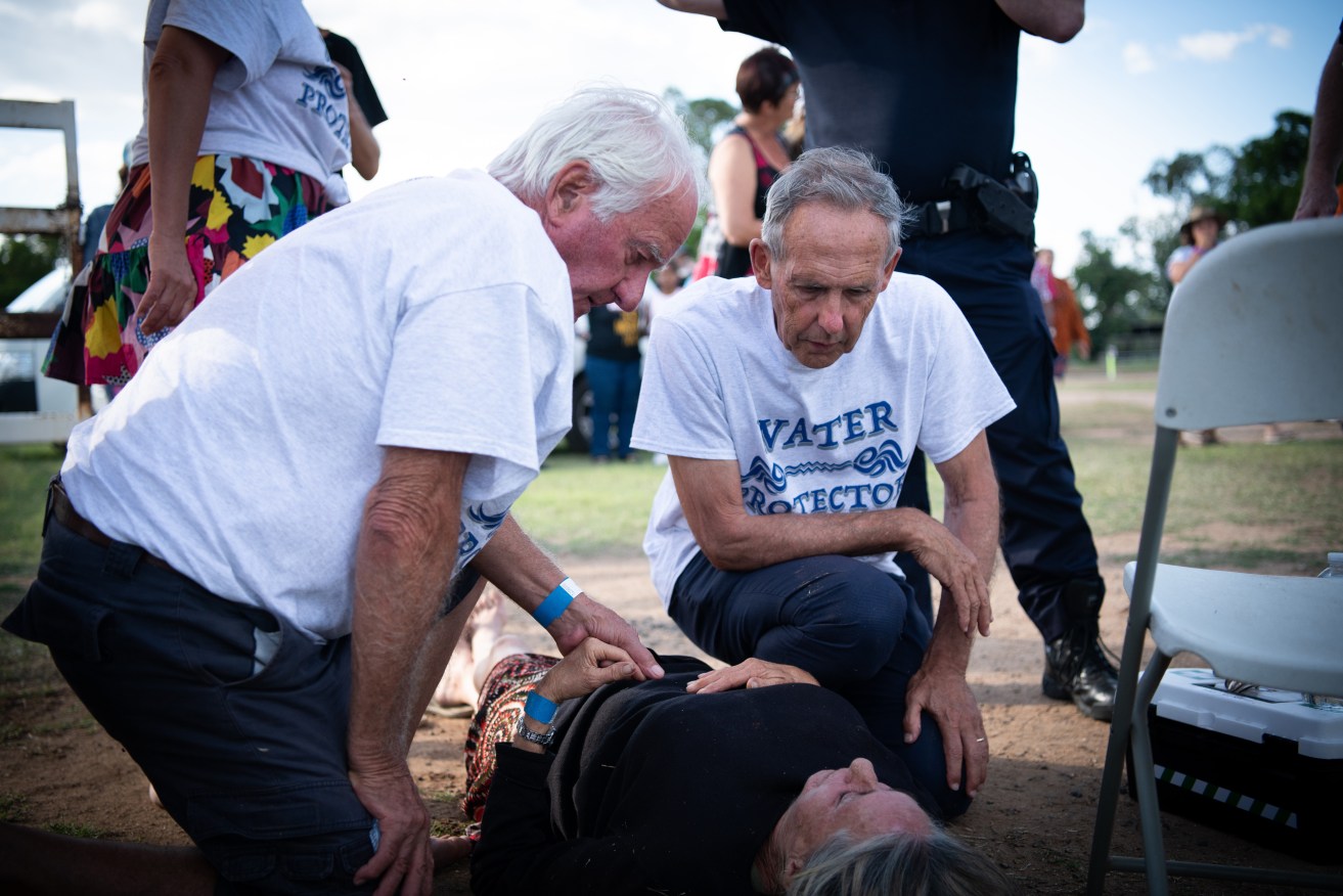 Former Greens leader Bob Brown with a woman injured by a horse during a Stop Adani Convoy event in Queensland. Photo: AAP/Matthew Newton/Bob Brown Foundation