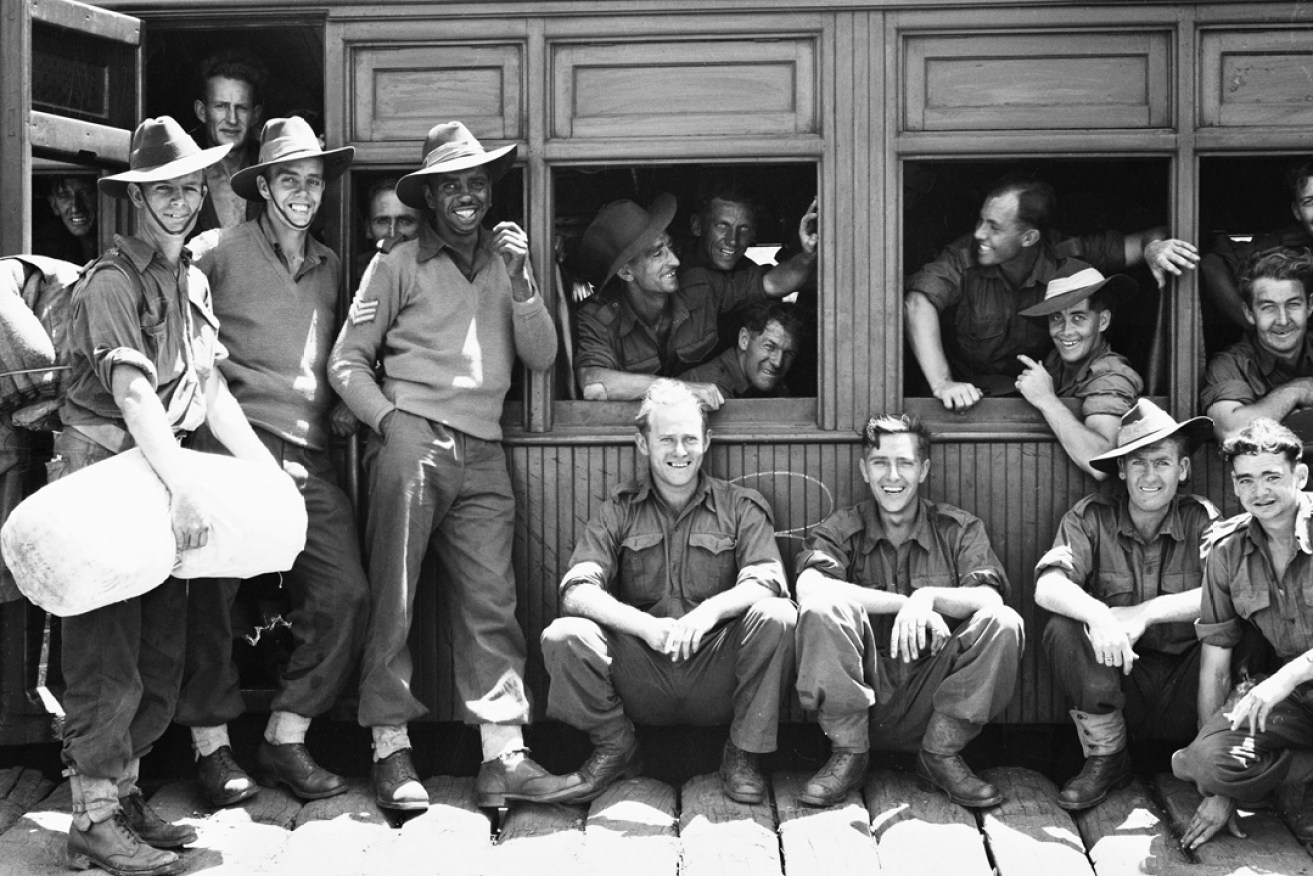 Reg Saunders, the first Aboriginal Australian to be commissioned as an officer in the Australian army, surrounded by his mates of the 2/7th Battalion, AIF, in 1943. Photo courtesy Australian War Memorial