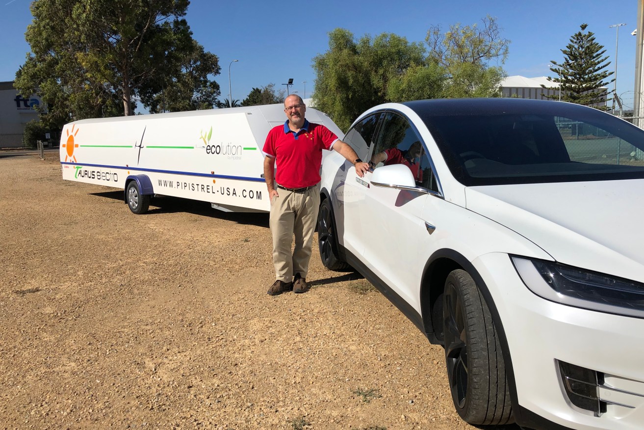 Simon Hackett with his Model X Tesla towing his electric plane. Photo: supplied