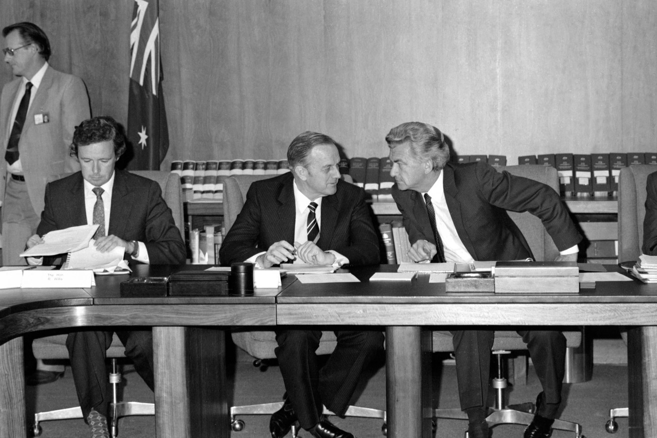 Prime Minister Bob Hawke in discussion with his deputy, Lionel Bowen, during the opening meeting of the first Hawke Cabinet in March 1983. Photo: AAP/National Archives of Australia