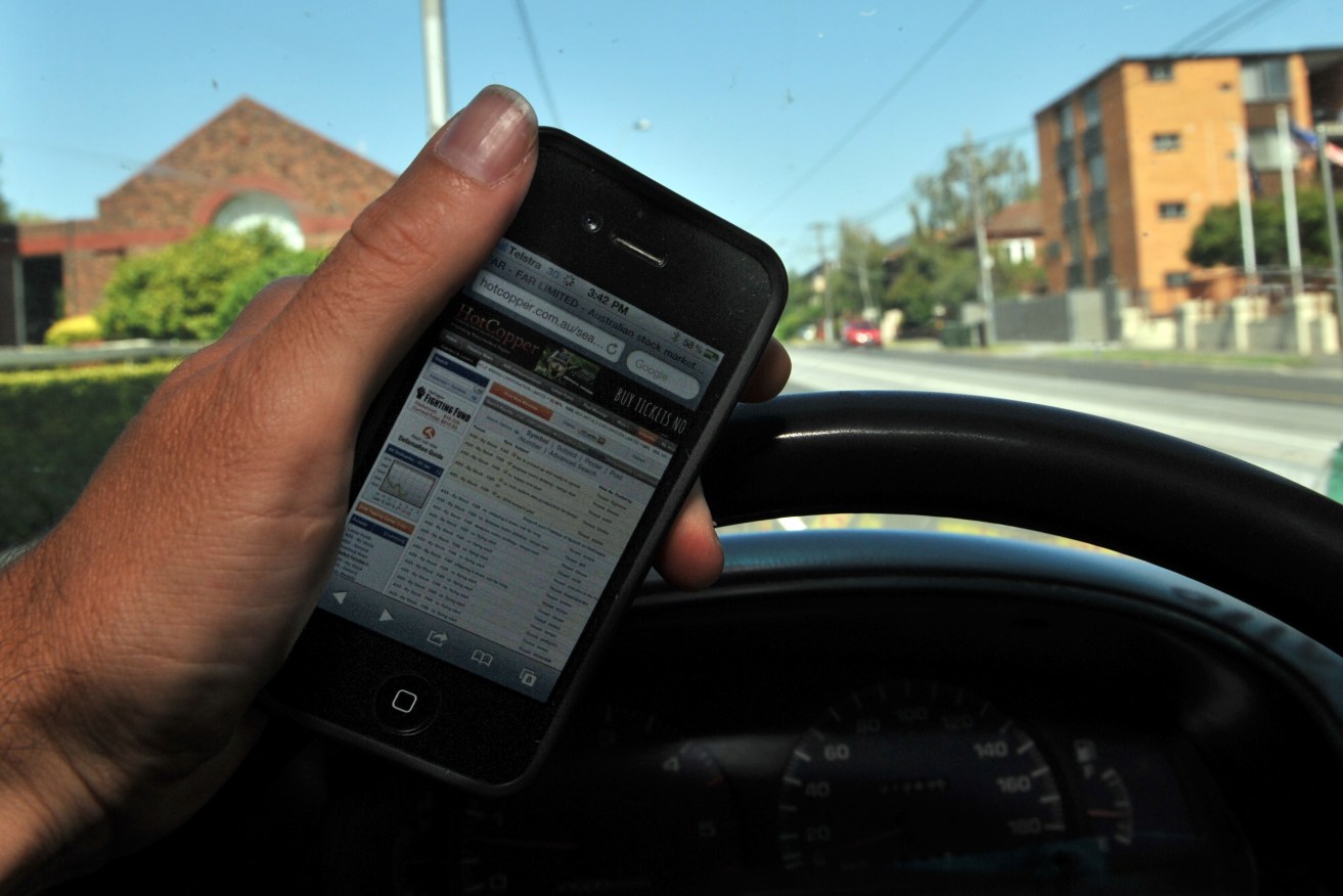 Fines for mobile phone use while driving will soar. Photo: Julian Smith / AAP