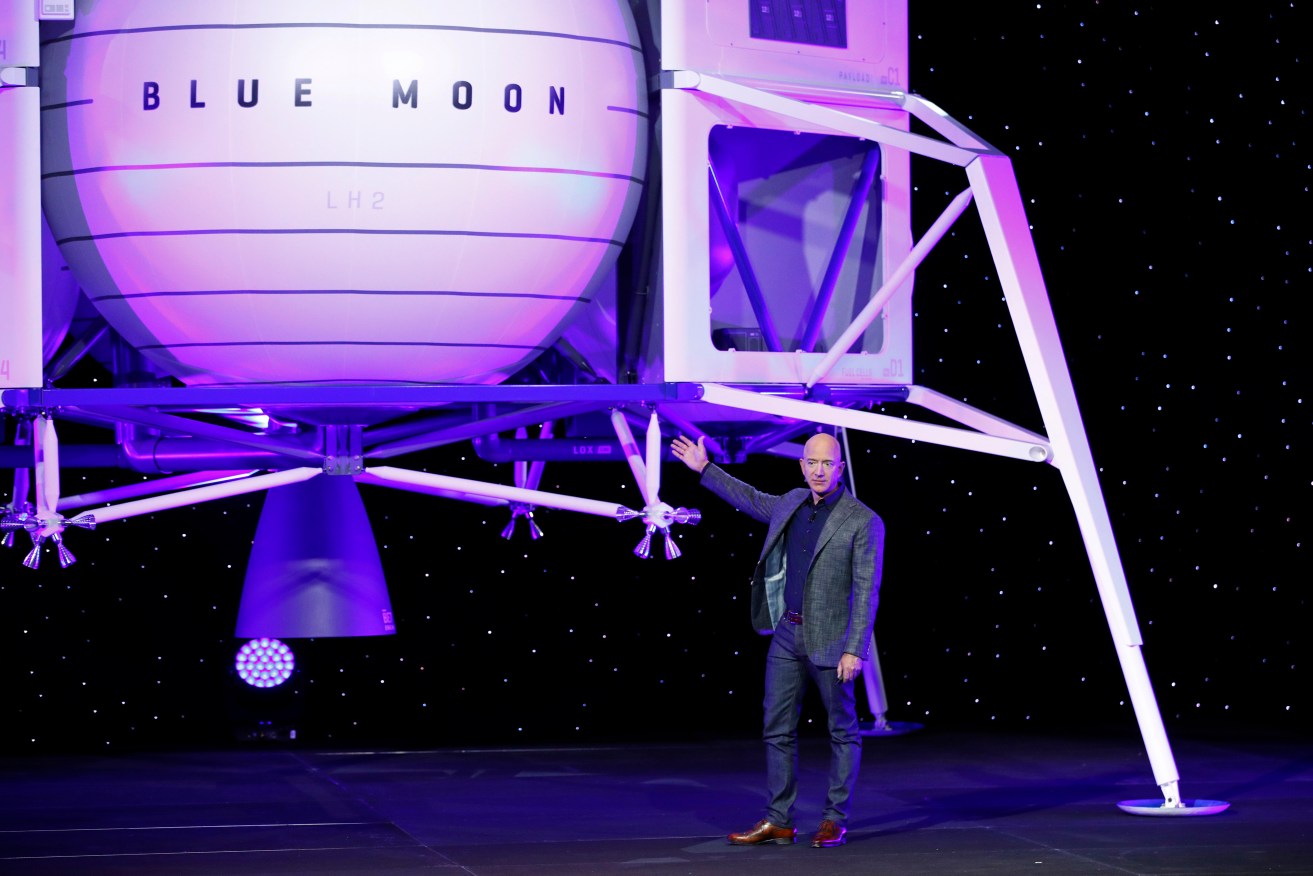 Jeff Bezos with a model of a Blue Origin lunar lander. Photo: AP/Patrick Semansky