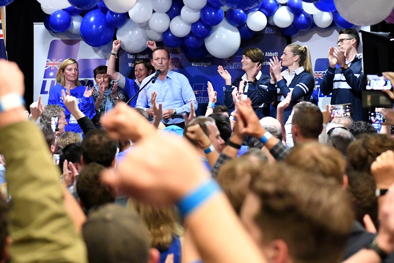 Former Prime Minister Tony Abbott concedes defeat in his Sydney seat but the crowd was buoyed by the Coalition's overall performance. Photo: AAP/Bianca De Marchi