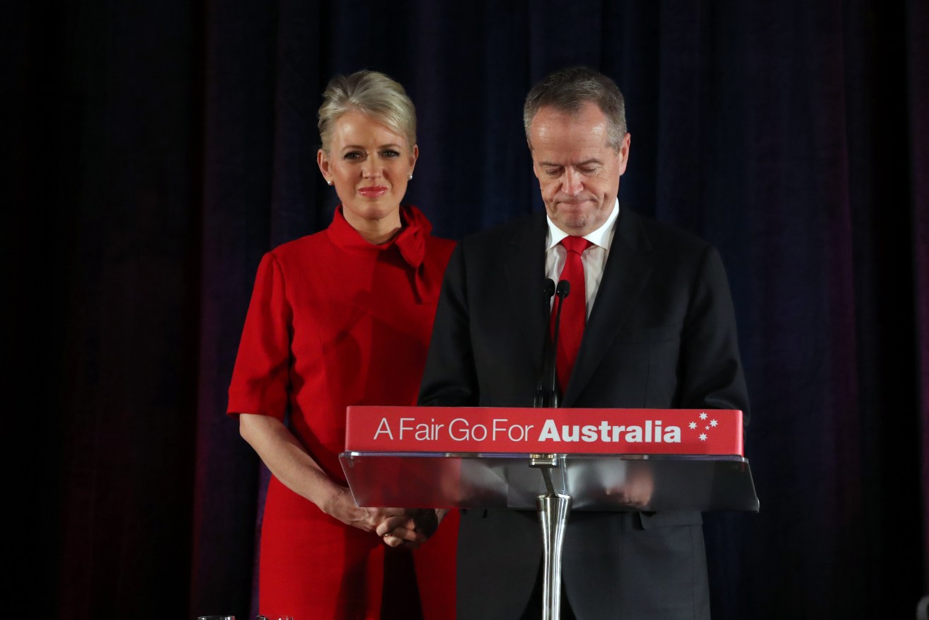 Bill Shorten concedes defeat on election night with his wife Chloe. Photo: AAP/David Crosling