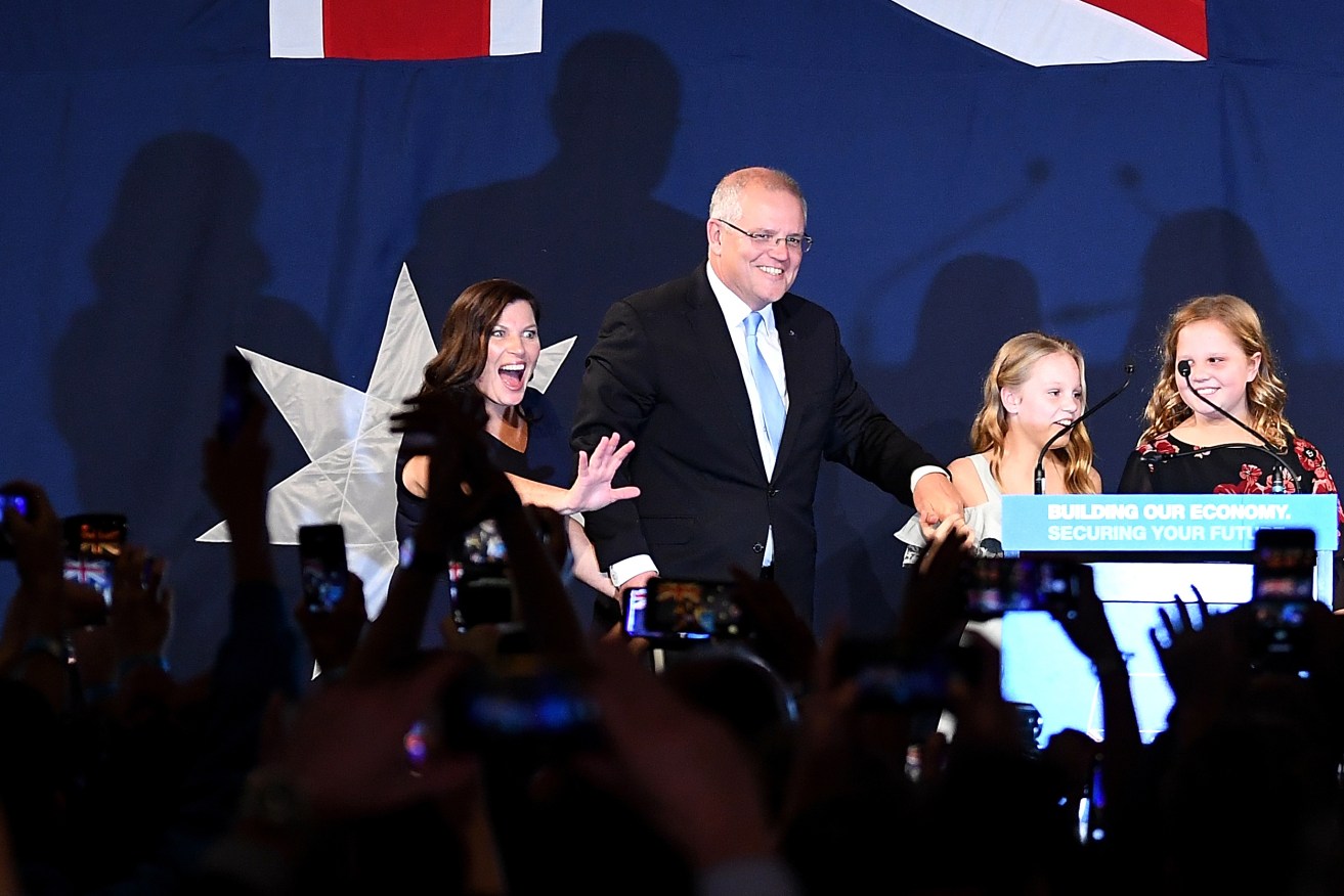 Prime Minister Scott Morrison with wife Jenny (left) children Abbey (second right) and Lily (right) after claiming victory. Photo: AAP/Dean Lewins